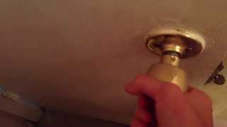 How to unlock a door with a twist knob lock.