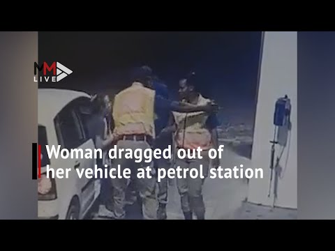CCTV captures woman being dragged out of her vehicle at petrol station