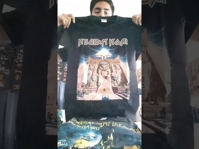 Vídeo relacionado con Camiseta Iron Maiden A Real Dead One. Camiseta Rock Oficial Negra. Banda Heavy Metal. Algodón. Unisex. Adulto Niño., Negro , X-Large