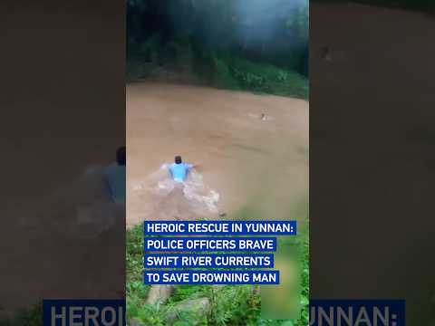 Heroic rescue in Yunnan: Police officers brave swift river currents to save drowning man#coolchina