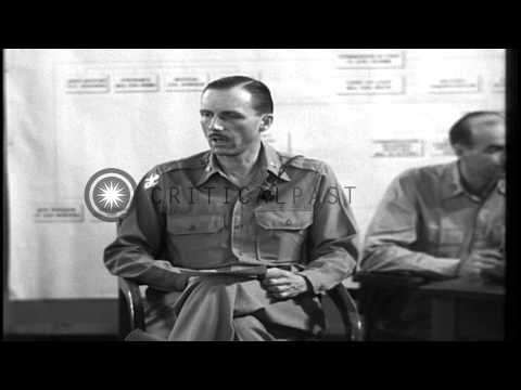 Major Tisdell talks about American surrender to the Japanese in 1942 during trial...HD Stock Footage