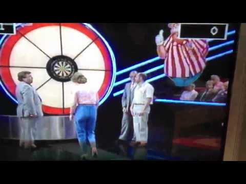 Jim Bowen pats female Bullseye contestant on the arse