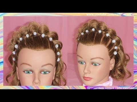 Peinados de niña que tienen el pelo corto y rizado
