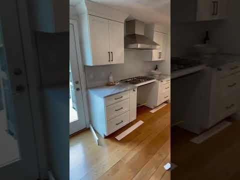 Floors are done- installation of base and toe kicks around perimeter and island-