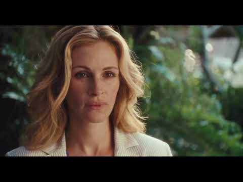 Trailer frame of Bali shoreline; party music drifting into night as narrative softens