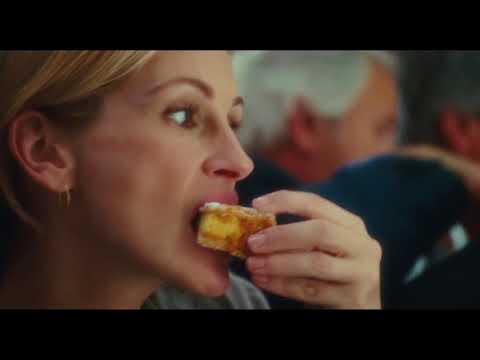 Trailer frame showing Indian ashram courtyard; meditative cues with drones and hand percussion