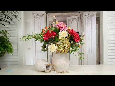 A rustic and informal gathering of dahlia, hydrangea, rosehip and olive