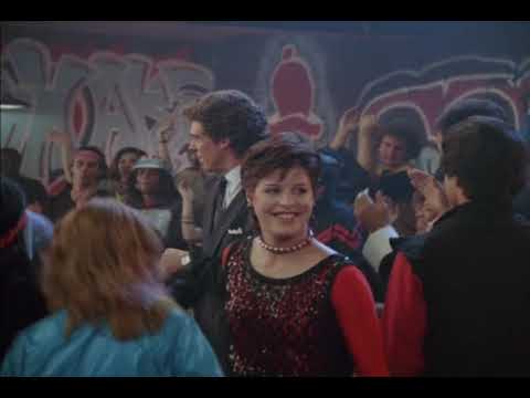 Trailer image: Radiotron crowd with raised hands, mirror ball and neon