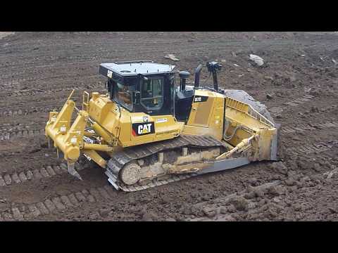 CATERPILLAR D7E pushing topsoil