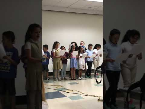 Yaneliz singing at School