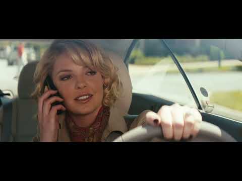 Killers (2010) official trailer still: Spencer and Jen framed against the Riviera, bright sun with a spy edge