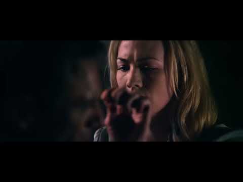 Official trailer still: Adam stands atop a cathedral gargoyle as winged demons swarm the sky