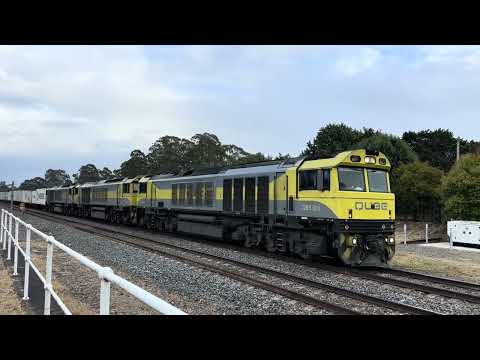 Three engine QUBE freight train hauling around 85 shipping containers, Marulan station