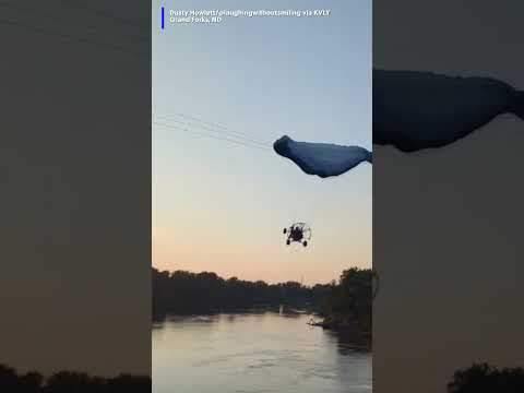 Oh, my! Video captured the moment a paraglider crashed into a powerline