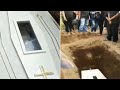 Terrifying moment corpse 'waves' from inside coffin sparking 'buried alive' fears