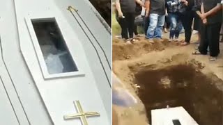Terrifying moment corpse &#39;waves&#39; from inside coffin sparking &#39;buried alive&#39; fears
