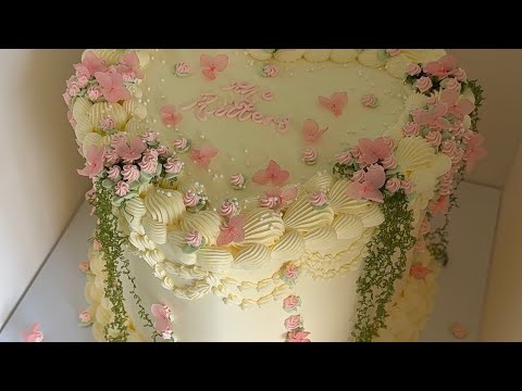 The most BEAUTIFUL whimsical wedding cake🥹🤍🌸🌷🌱✨