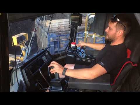 Caterpillar 990 Wheel Loader Loading Coal On Trucks - Operator View