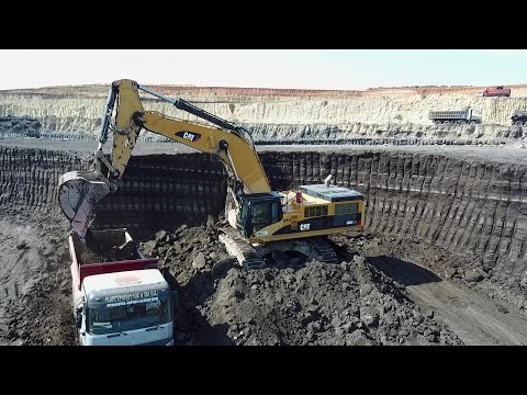 Caterpillar Excavators Working On Huge Coal Mine Area - Aerial View - Interkat SA