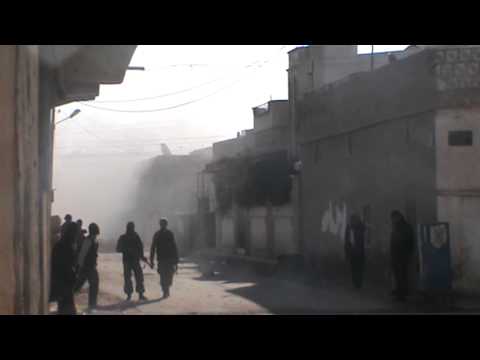 تصاعد الدخان جراء القصف العشوائي على مدينة معدان في ريف الرقة