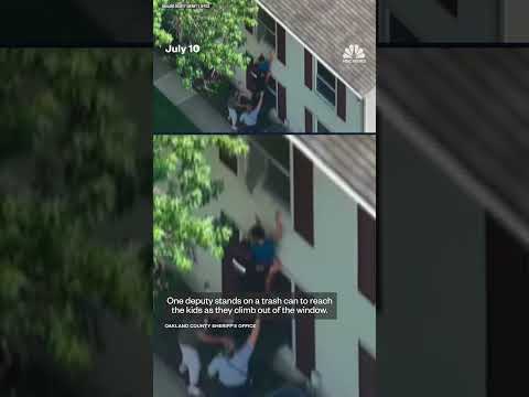 Sheriff's deputies rescue two children from a house fire in Michigan