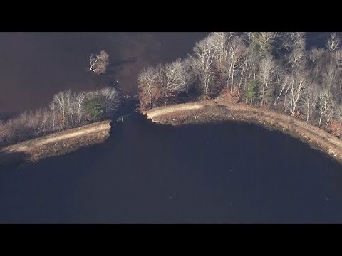 Breach of dam between two ponds leads to flooding