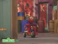 Sesame Street Elmo Riding A Tricycle
