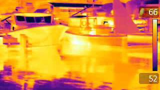Panning infrared view of docks after nightfall