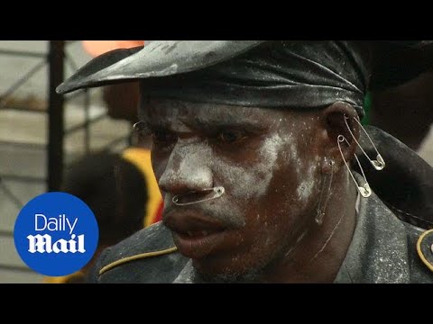 Haitians celebrate Day of the Dead with cemetary voodoo flair - Daily Mail