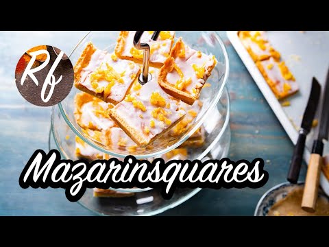 Mazarinsquares are cakes baked like Swedish Mazarins with almondfilling and shortcrust garnished with sugarfrosting and candied orange peels. >