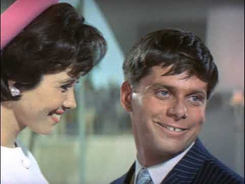 Boardroom freeze with a band punch—'Brotherhood of Man' cresting into applause