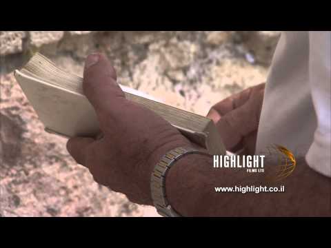 JJ_026 Highlight Films Israel footage store: C/U Jewish prayer book in The Western Wall