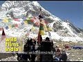 Sherpas putting up prayer flags at Everest Base ...
