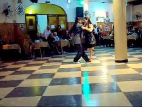  Andres Laza Moreno  and  Isabel Acuña  are  dancing  to  a  tango