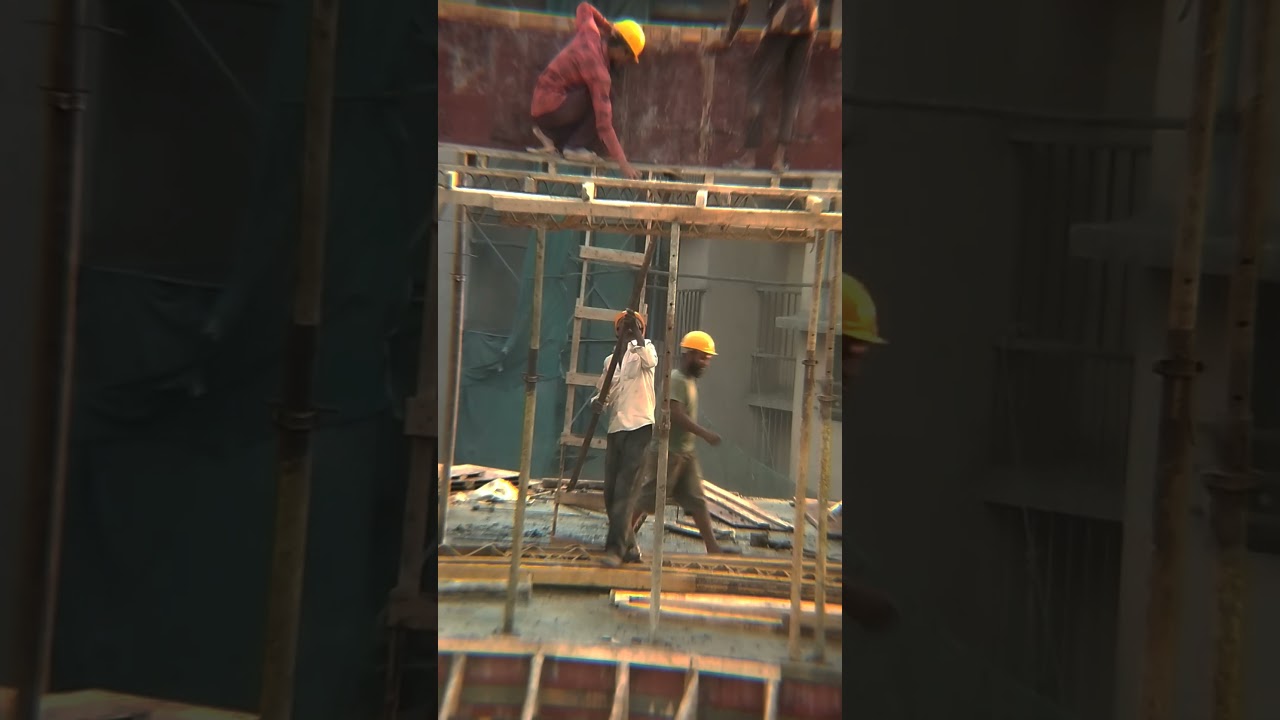 Worker providing support with iron pipe #workers #work #worker #support #construction #site