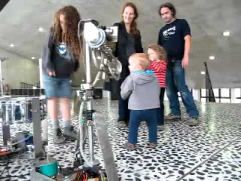 Artbots 2011: a kind baby thinks the robot looks hungry