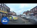 Police officer blocks busy street performing a 10-point turn - Daily Mail