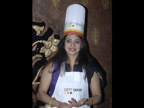 Actress Priya Raman mixing a cake