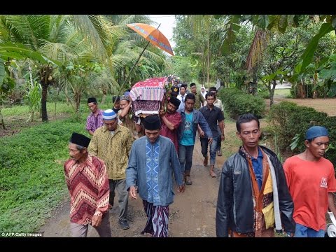 Heartbroken father of victim of Hong Kong 'psycho' banker looks on as villagers carry