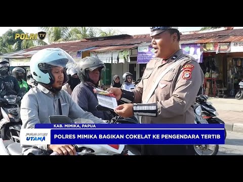 POLRES MIMIKA BAGI COKELAT KEPADA PENGENDARA TERTIB