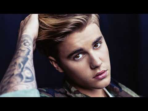 Justin Bieber and Hailey Bieber embracing during their vacation