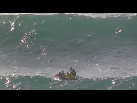 Extreme surfboat rowing in lifesaver relay Kurrawa Beach 2011