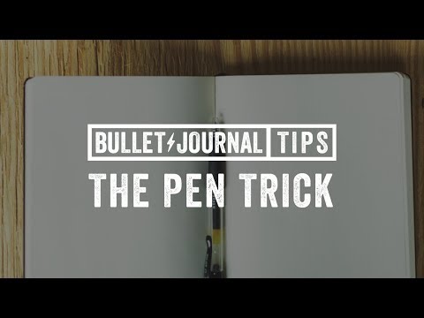 Part of a video titled Great Trick for Attaching a Pen to a Notebook - YouTube
