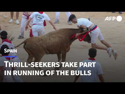 Video Thumbnail: 'So much adrenaline': Daredevils dodge charging bulls in Spain's San Fermin festival | AFP