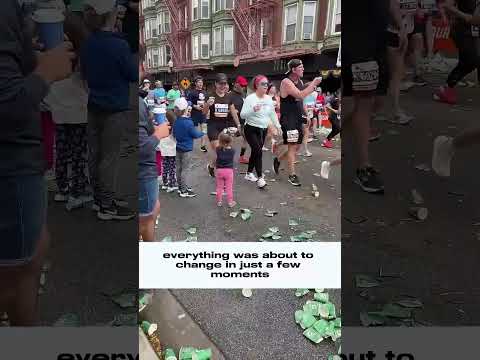 She helped the runners by offering them a cup of water.