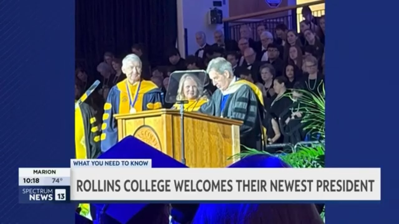 President Brooke Barnett at podium at inauguration with Grant Cornwell and Rick Goings