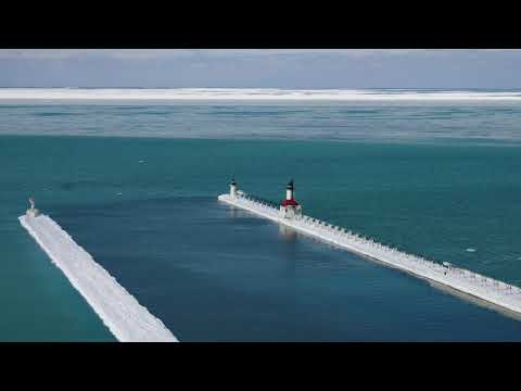 St  Joseph Michigan Frozen Lighthouse and Pier Aerial 4k Video