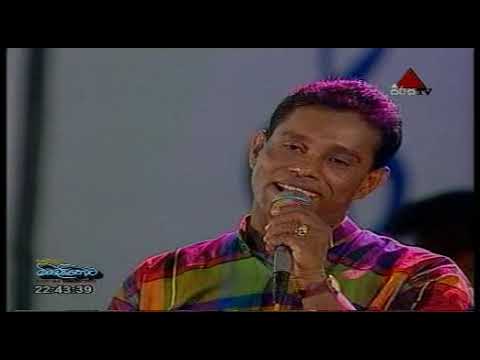 Seetha Kandu Yaye   Chandrasena Hettiarachchi and Chandralekha Perera with Sunflower