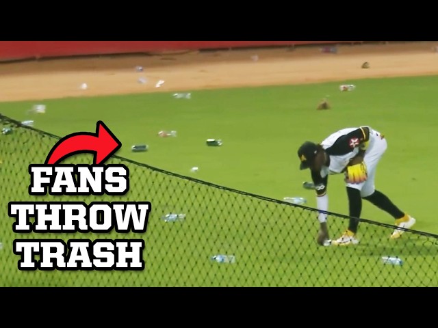 Fans throw trash on the field because obstruction was called on the catcher, a breakdown