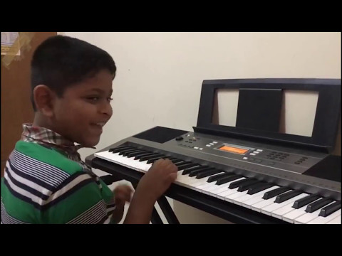 Pappu is playing Happy Birthday song in the keyboard
